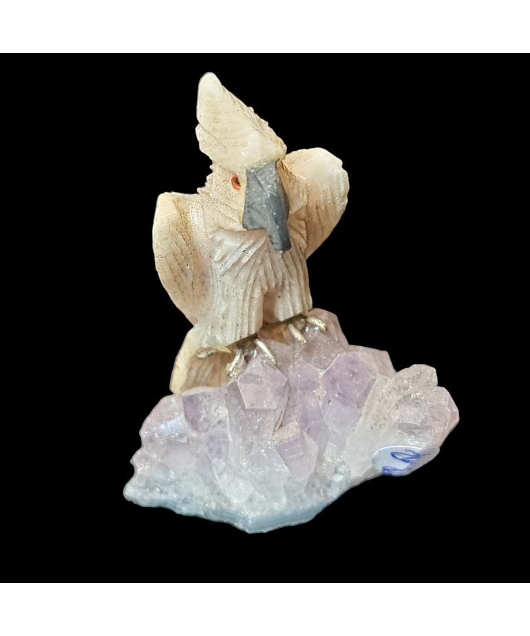 Oiseau Calcite jaune sur Améthyste