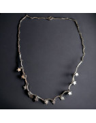 Collier chaînette Métal argentée avec petites breloques étoiles